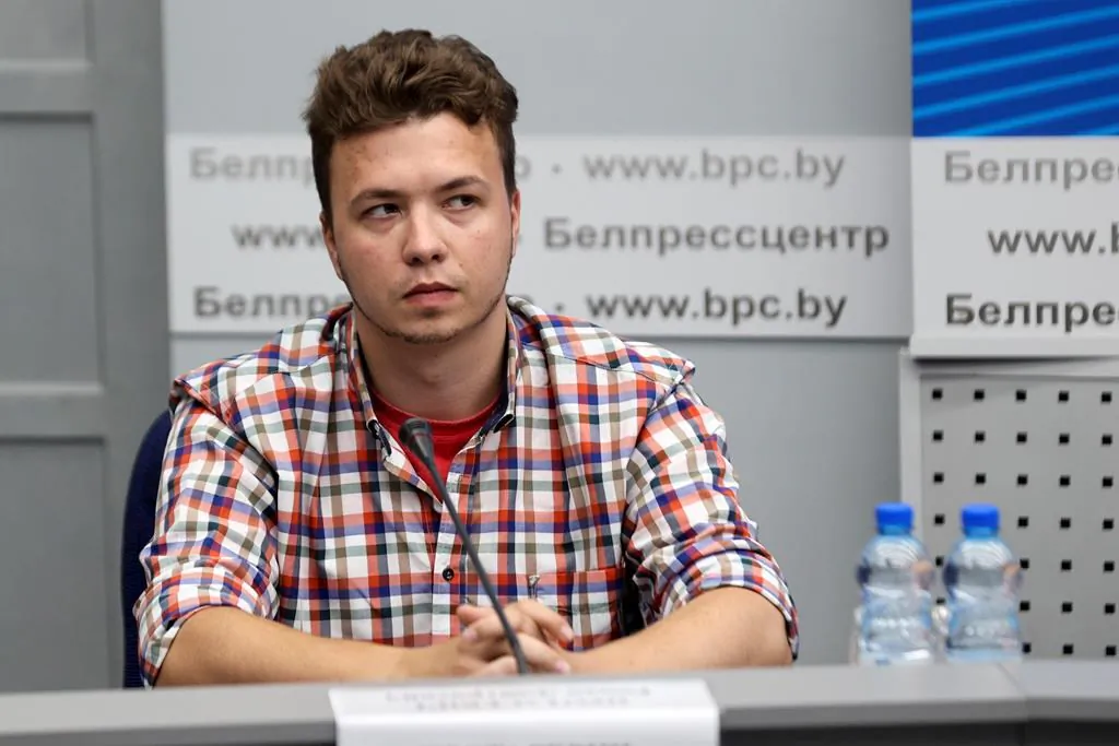 Belarusian dissident journalist Raman Pratasevich attends a news conference at the National Press Center of Ministry of Foreign Affairs in Minsk, Belarus on June 14, 2021. The dissident Belarusian journalist who was arrested when his airliner was diverted to Minsk was brought to a Foreign Ministry news conference on Monday, prompting a foreign journalist to walk out in protest. The opposition said the Monday appearance by Raman Pratasevich showed he is a hostage. (Ramil Nasibulin/BelTA pool photo via AP)