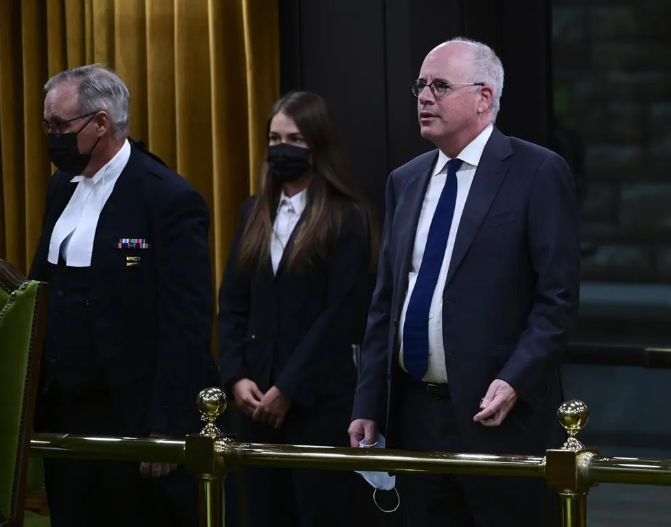 President of the Public Health Agency of Canada Iain Stewart, right, approaches the bar in the House of Commons to be admonished by the Speaker of the House of Commons Anthony Rota on Parliament Hill in Ottawa on June 21, 2021. (The Canadian Press/Sean Kilpatrick)