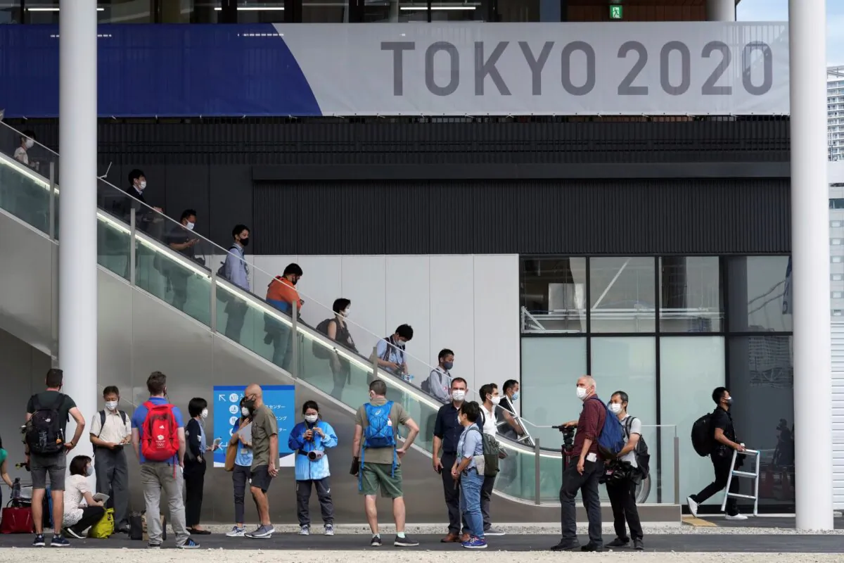 Journalists gather at Multifunctional Complex at the Tokyo 2020 Olympic and Paralympic Village during a media tour in Tokyo, on June 20, 2021. (Eugene Hoshiko/AP Photo)