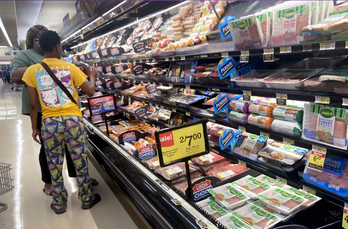 Customers shop for meat at a supermarket in Chicago, Illinois, on June 10, 2021. (Scott Olson/Getty Images)