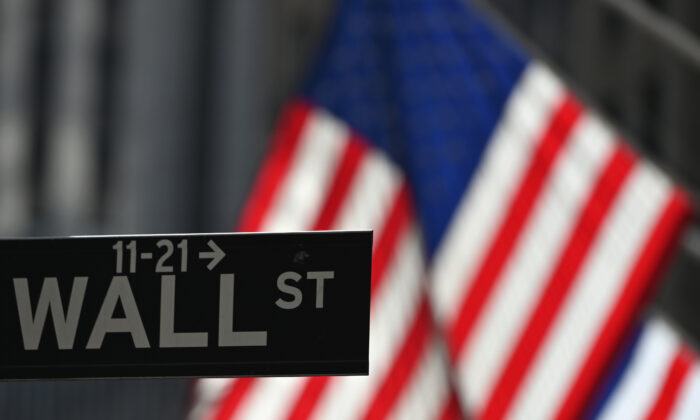 A Wall Street sign is seen at the New York Stock Exchange (NYSE) in New York City, on Feb. 17, 2021. (Angela Weiss/AFP via Getty Images)