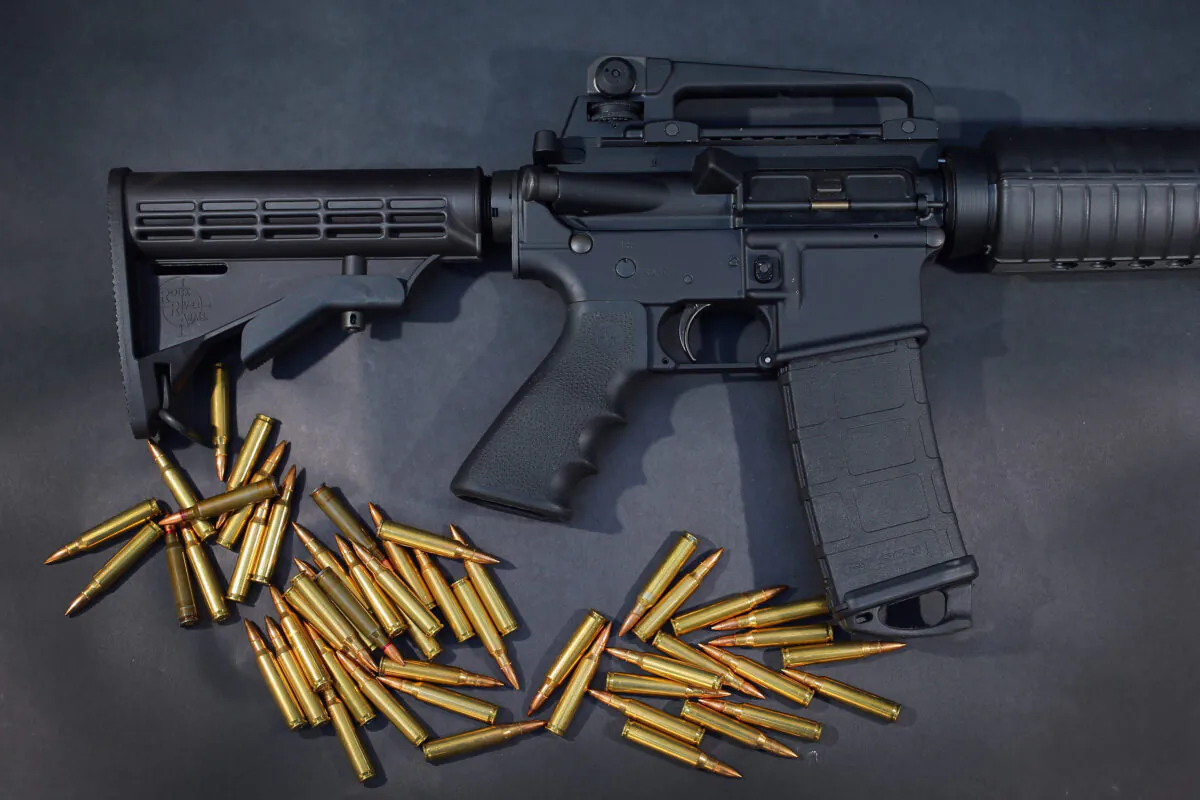 In this photo illustration, a Rock River Arms AR-15 rifle is seen with ammunition in Miami on Dec. 18, 2012. (Joe Raedle/Getty Images)