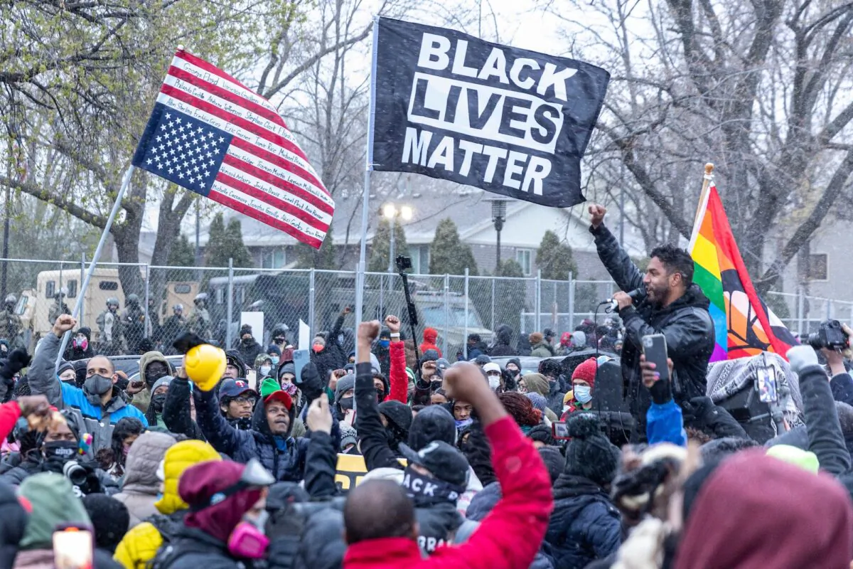 Protesters rally outside the Brooklyn Center police station in Minnesota on April 13, 2021. (Kerem Yucel/AFP via Getty Images)