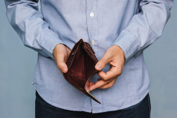 Bankruptcy,-,Business,Person,Holding,An,Empty,Wallet.,Man,Showing