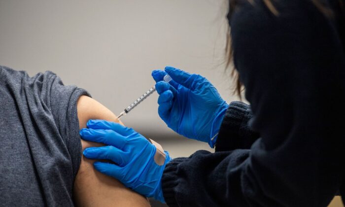 A person is inoculated with a vaccine in Chelsea, Mass. on Feb. 16, 2021. (Joseph Prezioso/AFP via Getty Images)