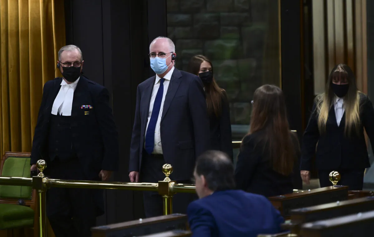 President of the Public Health Agency of Canada Iain Stewart, second from left, approaches the bar in the House of Commons to be admonished by the Speaker of the House of Commons Anthony Rota on Parliament Hill in Ottawa on June 21, 2021. (The Canadian Press/Sean Kilpatrick)