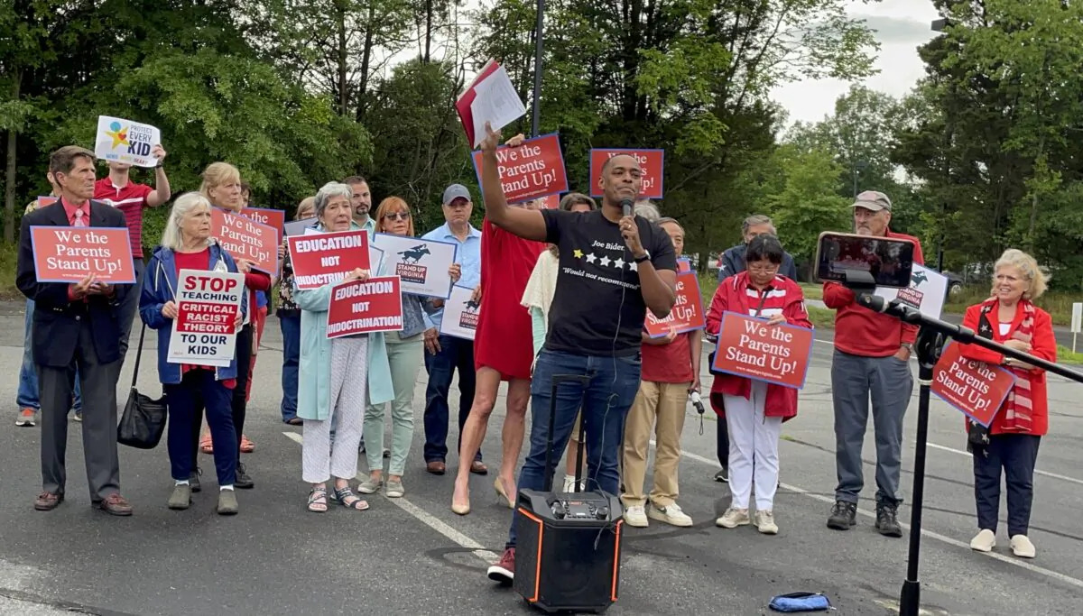 Joe Mobley with the Joe Mobley Show spoke at a rally outside the Loudoun County Public School administration building on June 22. (Terri Wu/The Epoch Times)