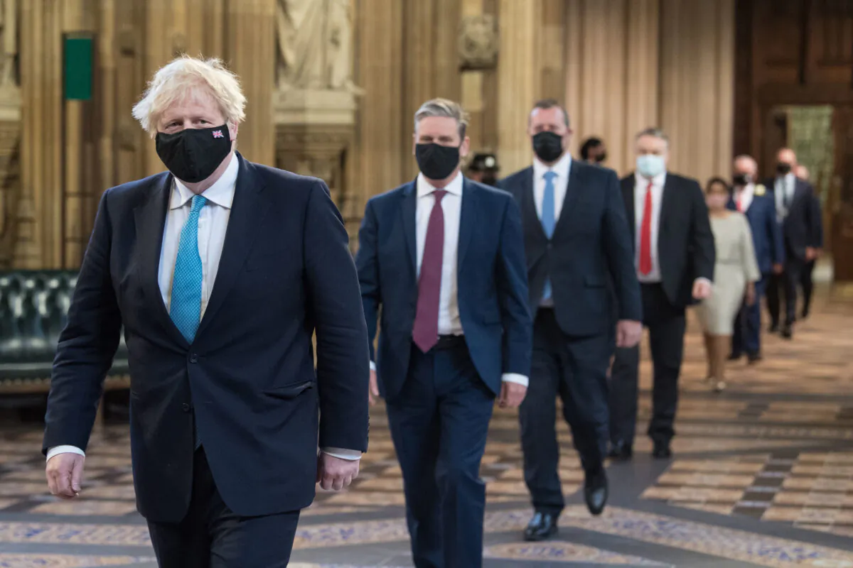 Prime Minister Boris Johnson (L) and Labour leader Sir Keir Starmer (2nd L) during the State Opening of Parliament in London, on May 11, 2021. (Stefan Rousseau/WPA Pool/Getty Images)