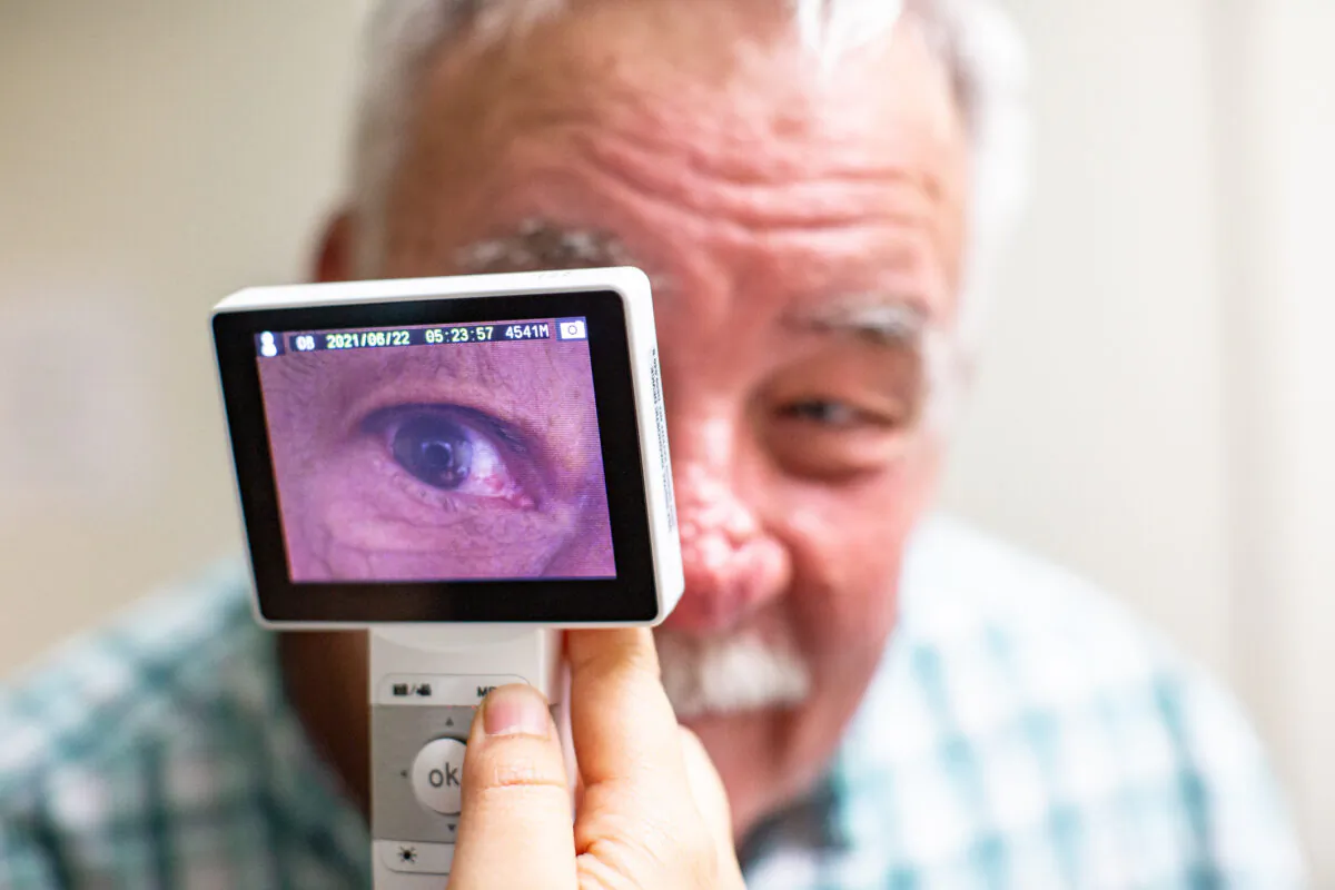 Lestonnac Free Clinic executive director Ed Gerber displays one of the telemedicine machine devices in Orange, Calif., on June 21, 2021. (John Fredricks/The Epoch Times)