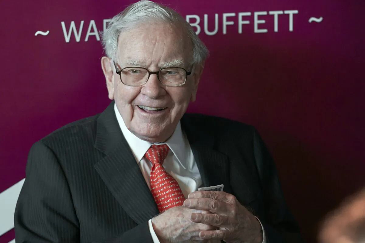 Warren Buffett, Chairman and CEO of Berkshire Hathaway, smiles as he plays bridge following the annual Berkshire Hathaway shareholders meeting in Omaha, Neb. on May 5, 2019 (Nati Harnik, File/AP Photo)