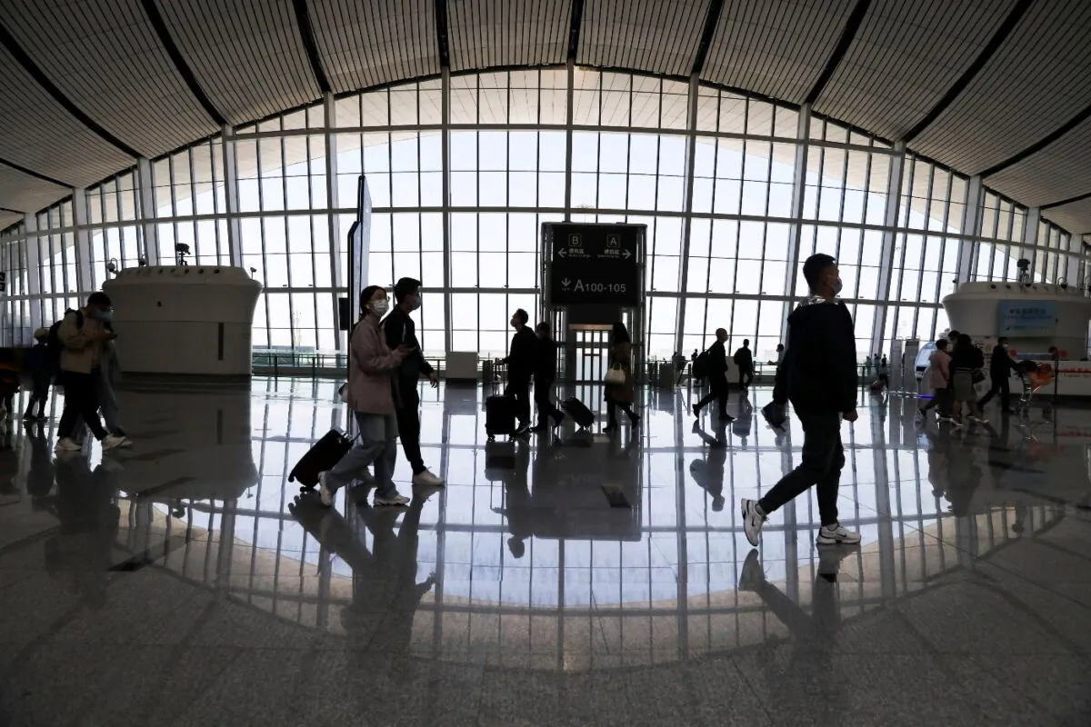 Travellers are seen at the Beijing Daxing International Airport on the first day of Labour Day holiday, in Beijing, China, on May 1, 2021. (Tingshu Wang/File Photo/Reuters)