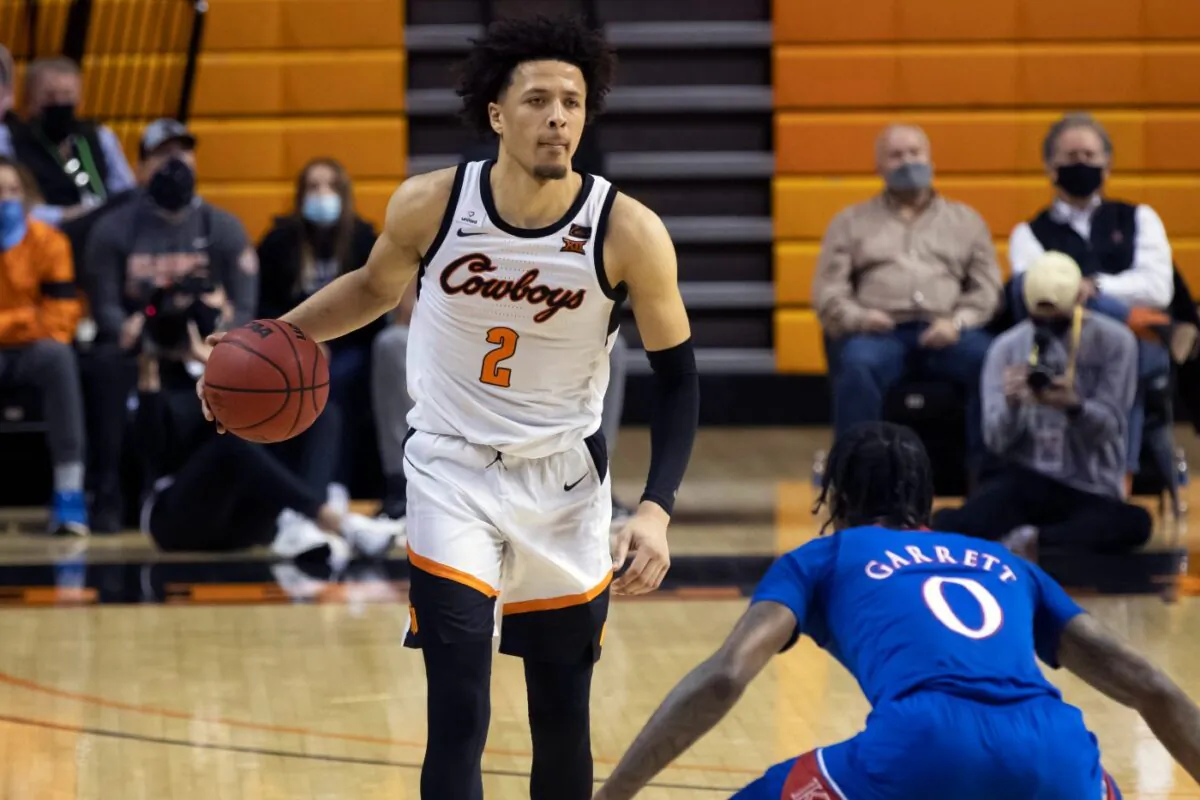Oklahoma State's Cade Cunningham (2) brings the ball up the court during the second half of the NCAA college basketball game against Kansas in Stillwater, Okla., on Jan. 12, 2021. (Mitch Alcala/File/AP Photo)