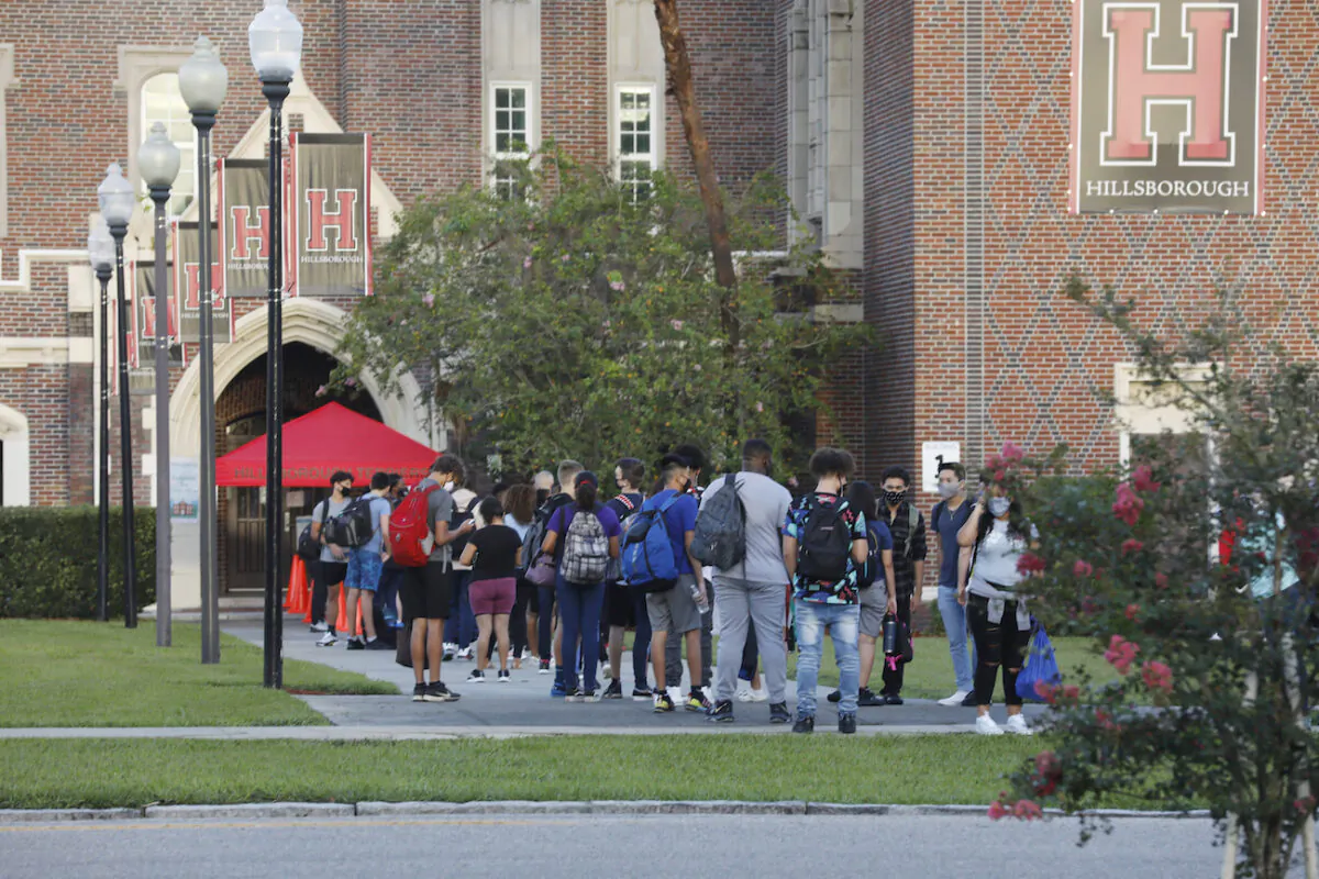 Students at Hillsborough High School wait in line to have temperature checked before entering the building in Tampa, Fla., on Aug. 31, 2020. (Octavio Jones/Getty Images)