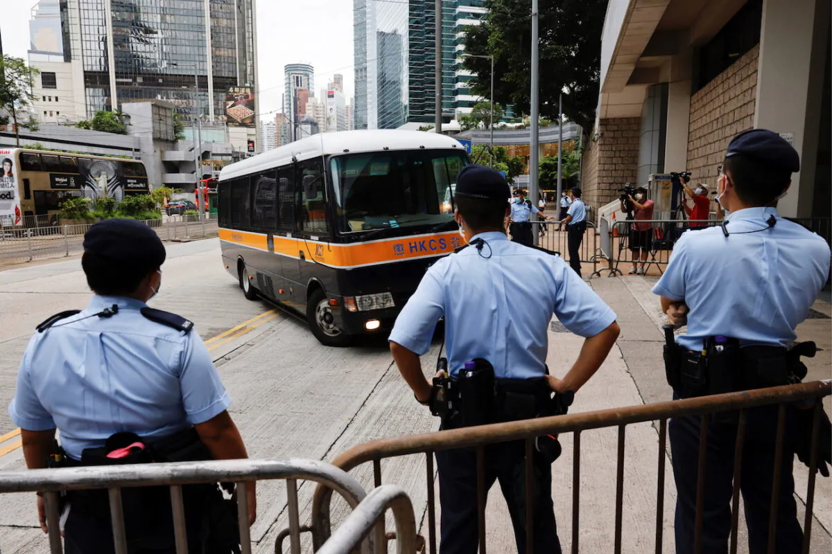 A prison van arrives at the High Court on the first day of trial of Tong Ying-kit, the first person charged under a new national security law, in Hong Kong, on June 23, 2021. (Tyrone Siu/Reuters)