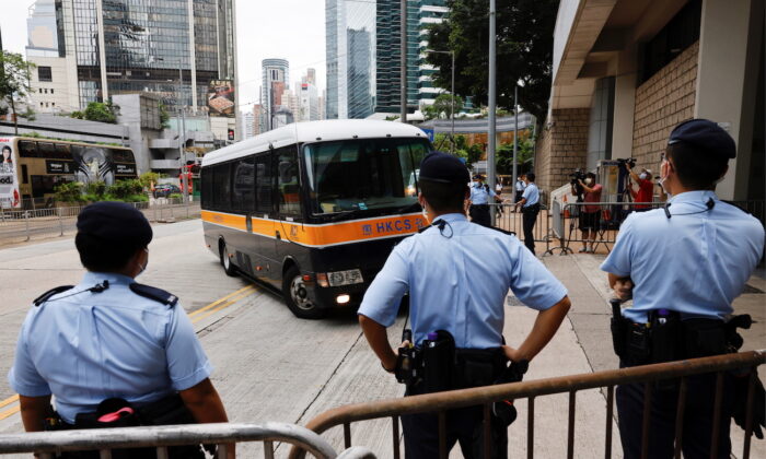 A prison van arrives at the High Court on the first day of trial of Tong Ying-kit, the first person charged under a new national security law, in Hong Kong, on June 23, 2021. (Tyrone Siu/Reuters)