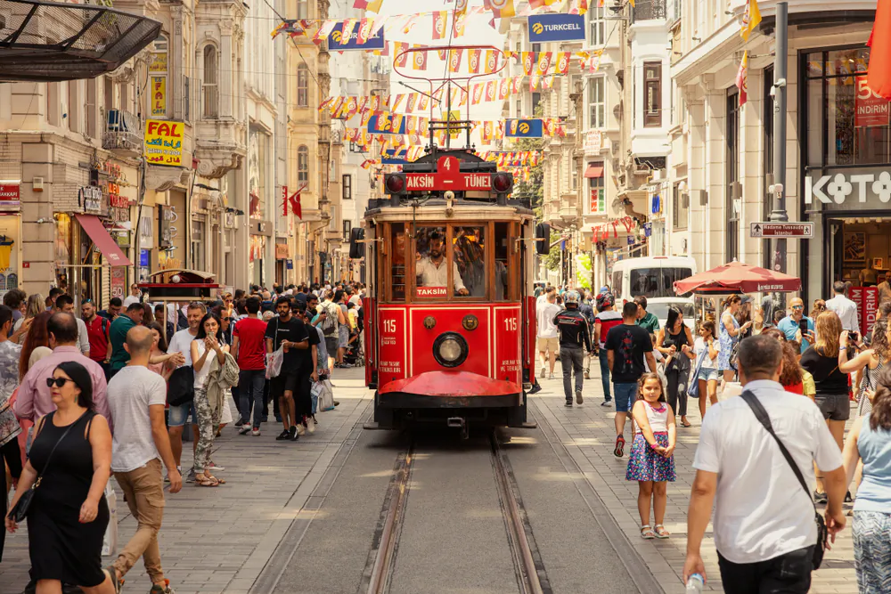 A tram moves along Istiklal Avenue towards Taksim Square on June 9, 2019. Although it is the main street, you can find some tucked-away spots along the way. (Vakidzasi/Shutterstock)