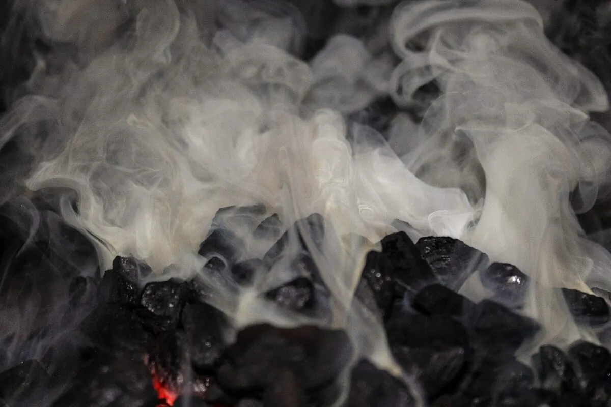 Ignited coal producing smoke. (Pixabay)