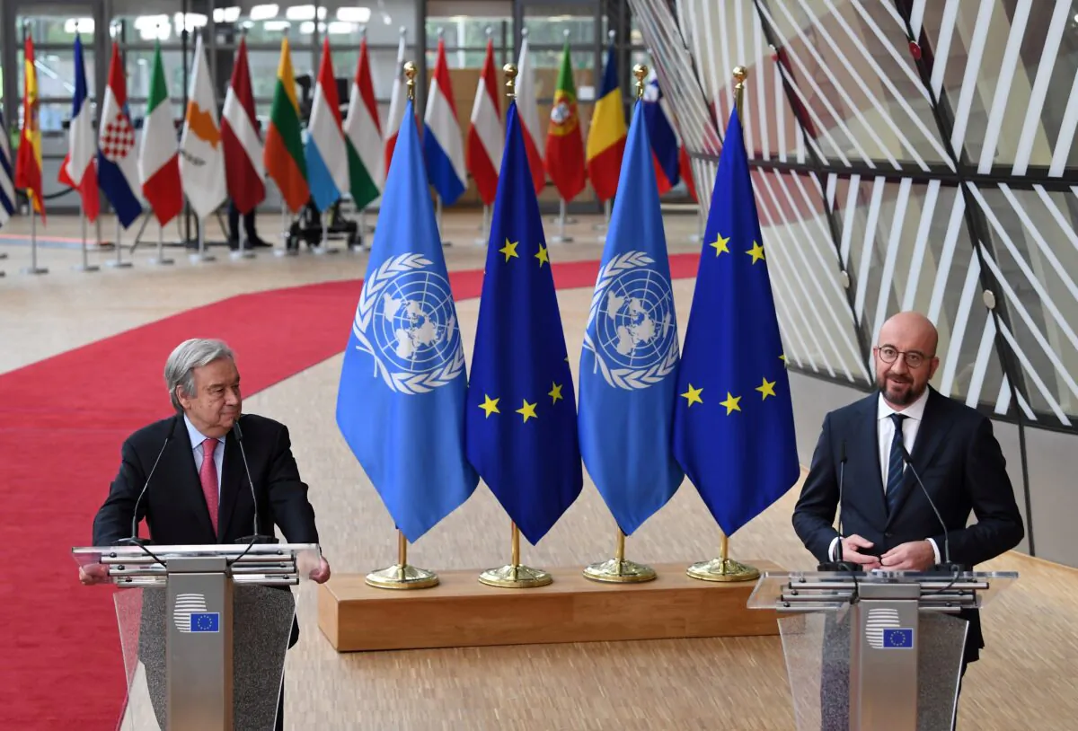 United Nations Secretary-General Antonio Guterres and European Council President Charles Michel address the media as they arrive on the first day of the European Union summit at the European Council Building in Brussels, on June 24, 2021. (John Thys/Pool via Reuters)