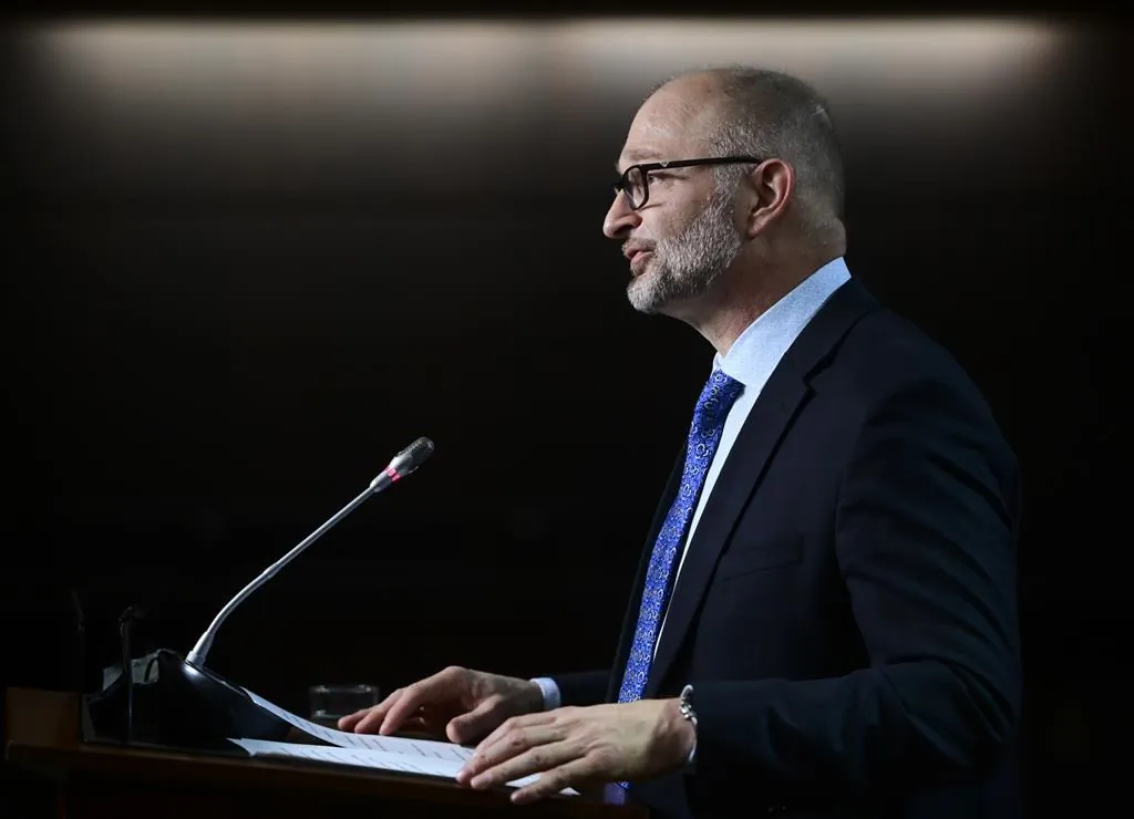 David Lametti, Minister of Justice and Attorney General of Canada, delivers a statement on Bill C-7 during a media availability on Parliament Hill in Ottawa on March 11, 2021. (The Canadian Press/Sean Kilpatrick)