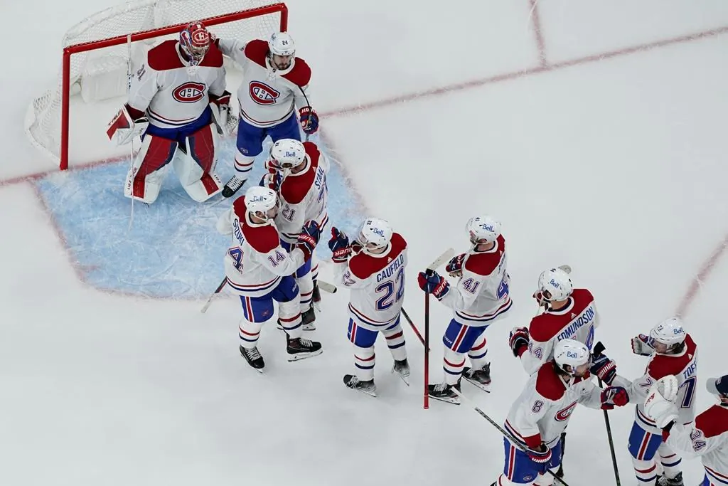 Montreal Canadiens celebrate after defeating the Vegas Golden Knights in Game 5 of an NHL hockey Stanley Cup semifinal playoff series on June 22, 2021, in Las Vegas. (AP/The Canadian Press/John Locher)