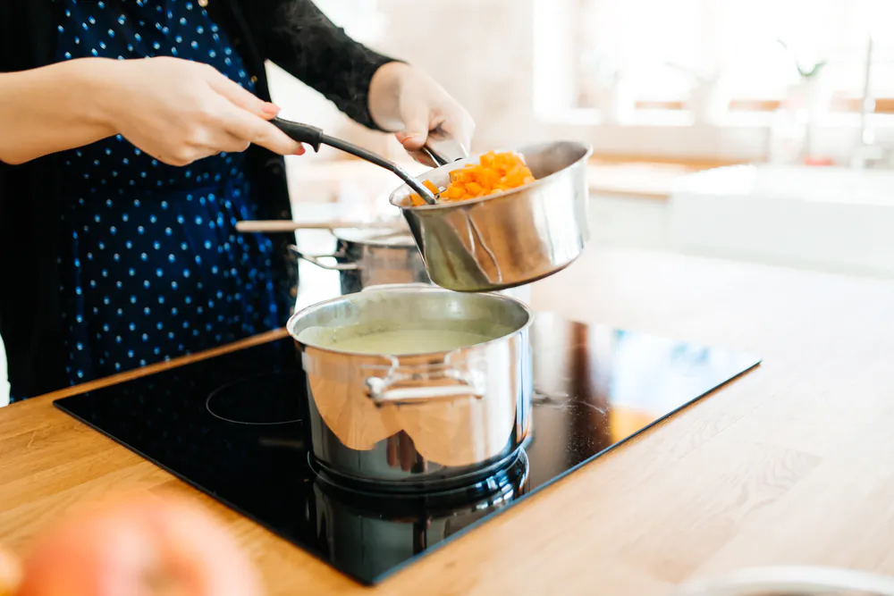 Once you get the hang of induction cooking, chances are you'll not want to look back to either traditional electric or gas cooking. (NDAB Creativity/Shutterstock)