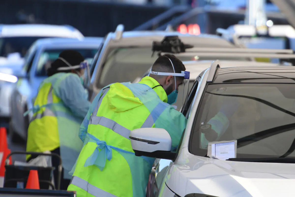 People queue in their cars to get tested for COVID-19 at a pop-up testing clinic at Bondi Beach in Sydney, Australia on June 25, 2021. (Dean Lewins/AAP Image via AP)