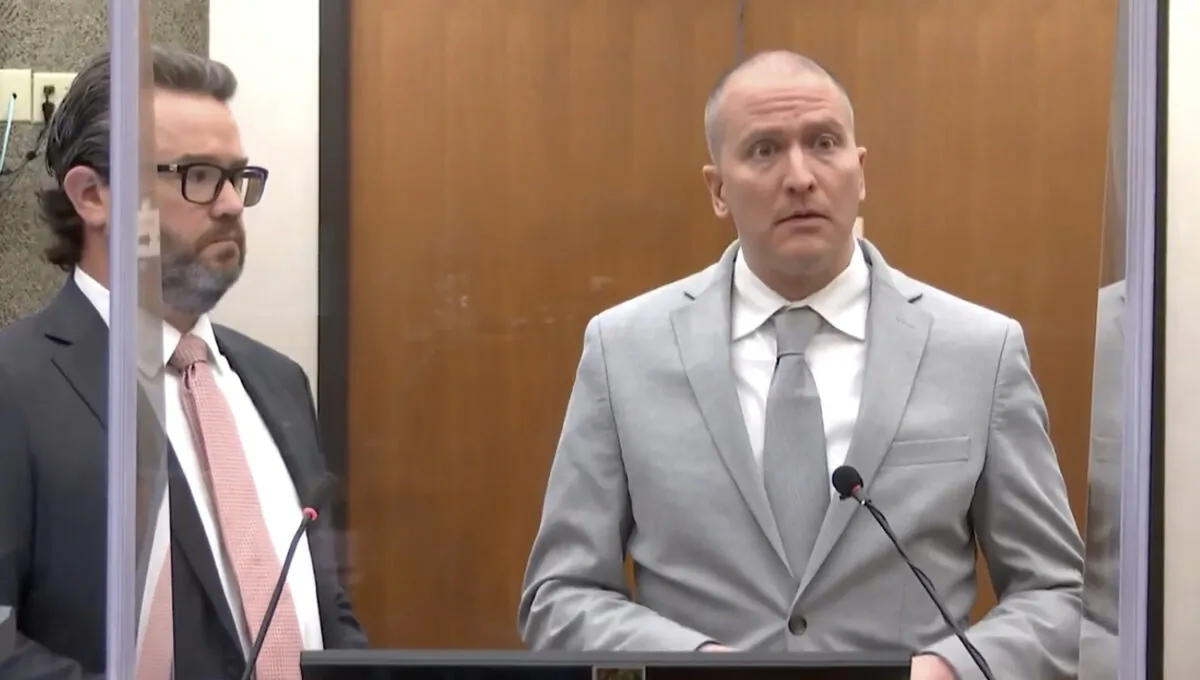 In this image taken from video, former Minneapolis police Officer Derek Chauvin (R) accompanied by defense attorney Eric Nelson, addresses the court as Hennepin County Judge Peter Cahill presides over Chauvin's sentencing at the Hennepin County Courthouse in Minneapolis, Minn., on June 25, 2021. (Court TV via AP, Pool)