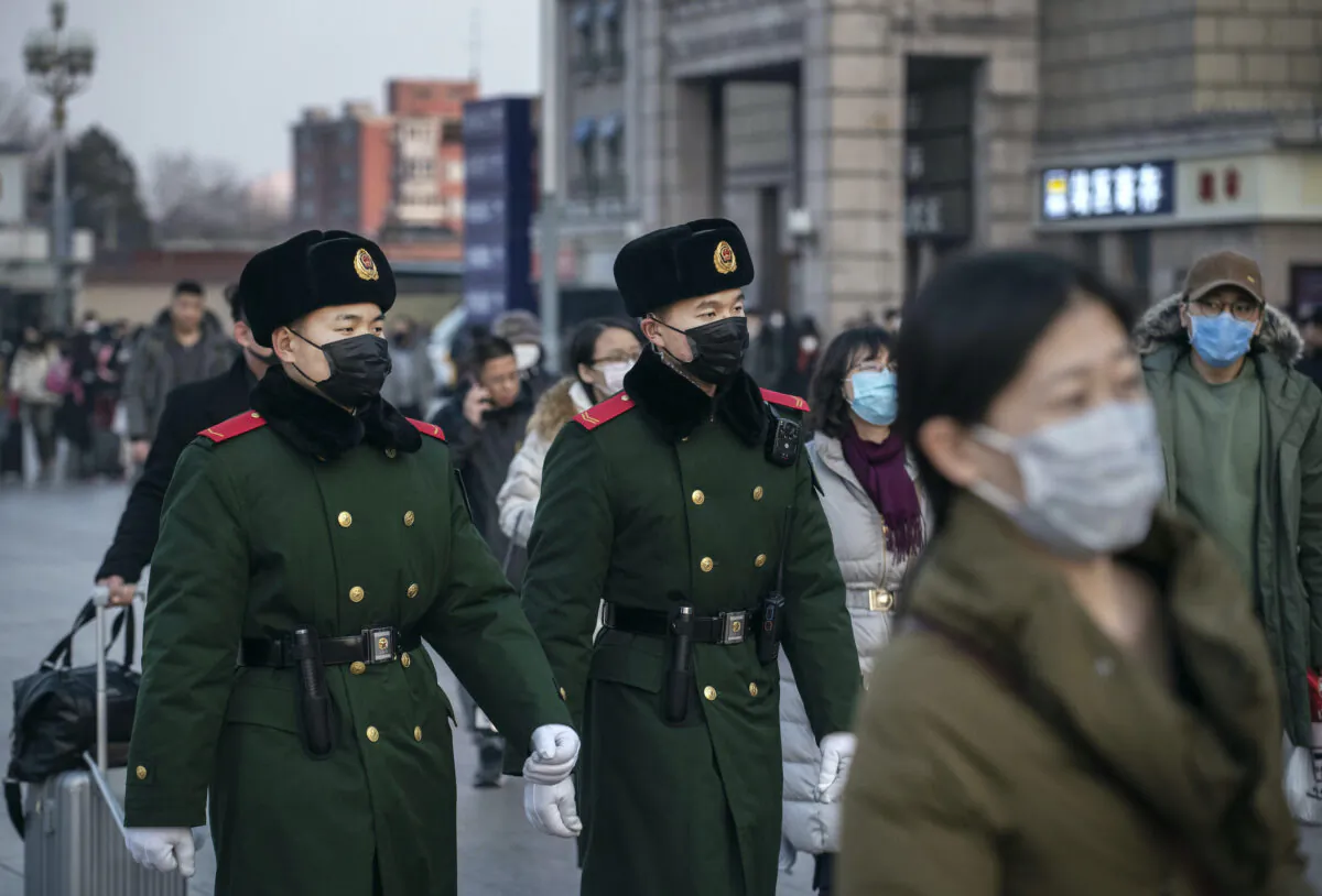 Chinese police officers patrol in Beijing, on Jan. 22, 2020. (Kevin Frayer/Getty Images)