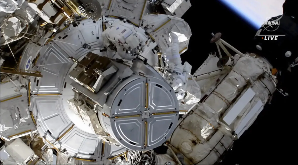 Astronauts NASA's Shane Kimbrough and France's Thomas Pesquet during a space walk outside the International Space Station on June 25, 2021. (NASA via AP)
