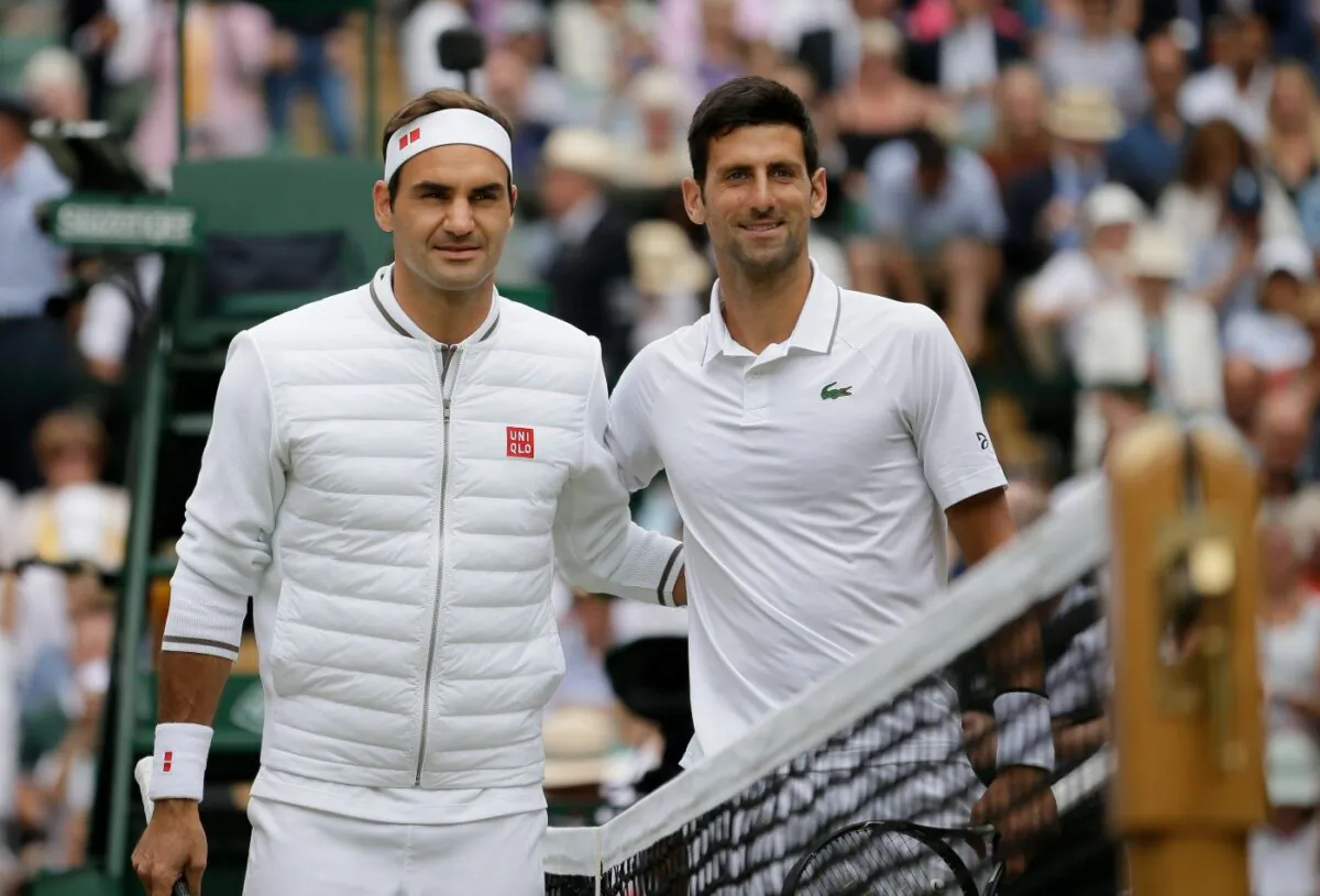 Switzerland's Roger Federer (L) and Serbia's Novak Djokovic poses before the men's singles final match of the Wimbledon Tennis Championships in London, on July 14, 2019. (Tim Ireland/File/AP Photo)