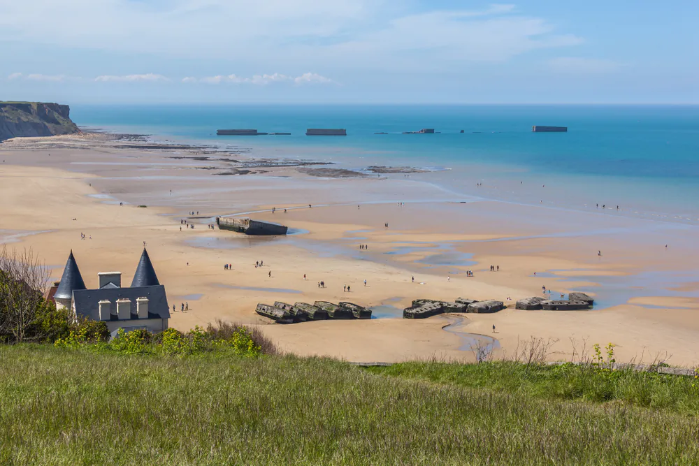 Arromanches-les-Bains beach with the remains of the Mulberry harbor in Normandy, France. (Shandarov Arkadii/Shutterstock)