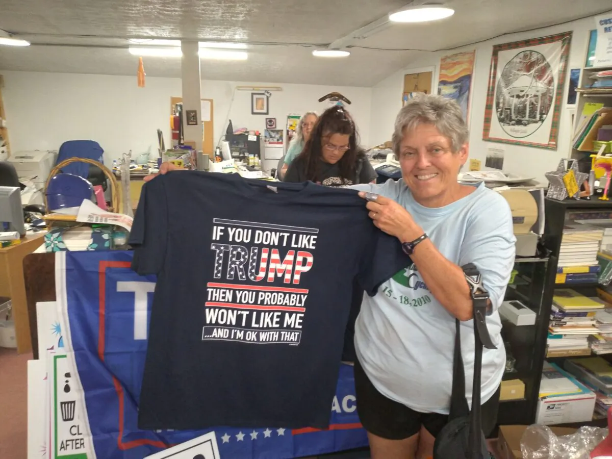 Cheri Diederich of Elyria, displays her new Trump T-shirt purchased at Special Effects Custom Printing in Wellington, Ohio, on June 25, 2021. (Courtesy of Michael Sakal)