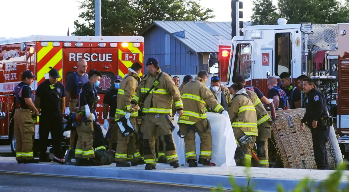 Albuquerque Fire Rescue crews work on victims of the fatal balloon crash at Unser and Central SW in Albuquerque, N.M., on June 26, 2021. (Adolphe Pierre-Louis/The Albuquerque Journal via AP)
