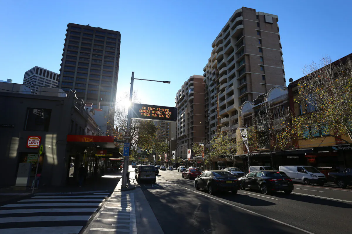 A government message is seen displayed on a digital sign on Oxford Street ahead of lockdown restrictions being imposed in Sydney, Australia, on Jun. 25, 2021. (Lisa Maree Williams/Getty Images)