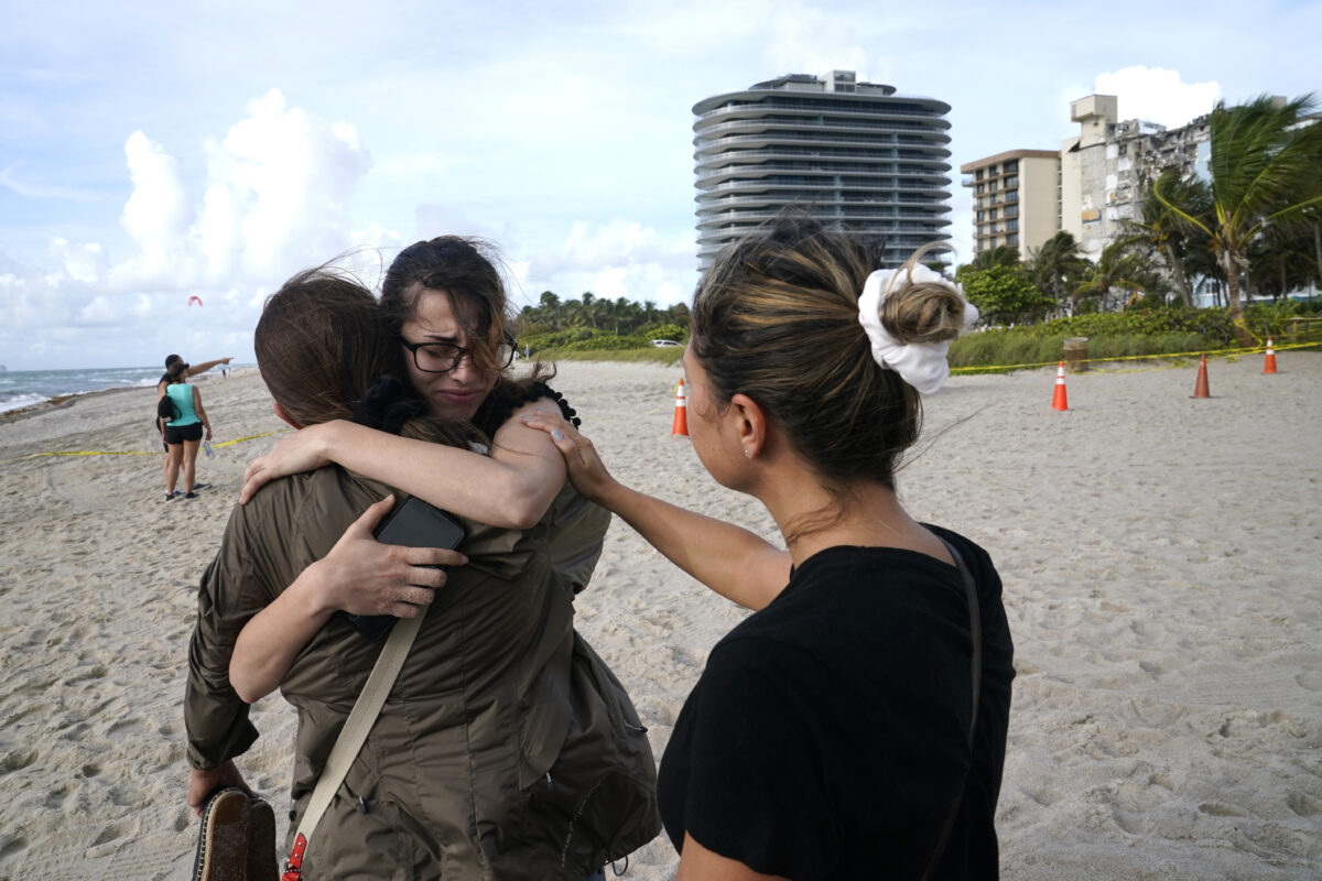 people-hug-at-site-of-building-collapse-miami