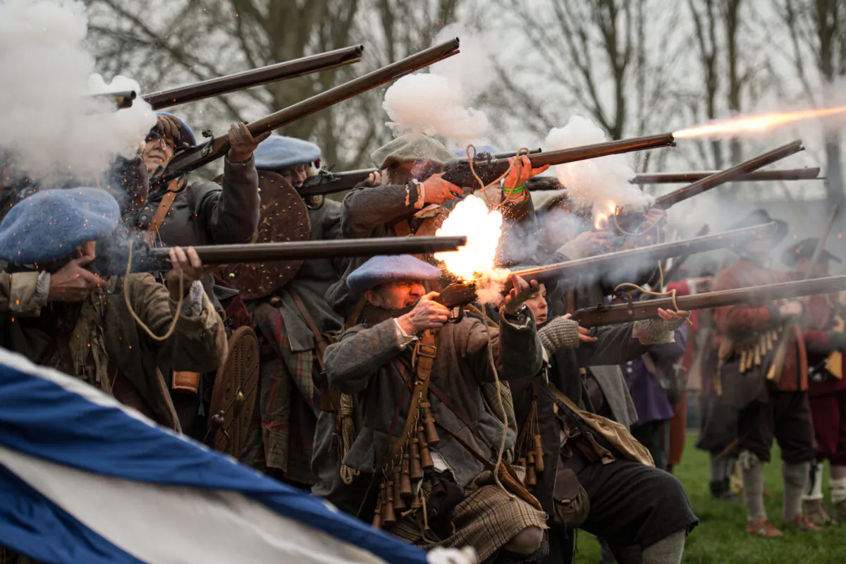 Members of the Sealed Knot, a society promoting interest in the English Civil War, fire muskets as they stage a reenactment of the Battle of Nantwich, a battle which took place near the town in 1644, in north west England on Jan. 25, 2020. The first modern re-enactment of the Battle of Nantwich took place in 1973 and has taken place every year since. In January 1643, Parliamentarians took the town of Namptwiche (Cheshires second town). By the end of December, the town was surrounded by Royalists and under siege. A Parliamentarian force marched south from Lancashire under the command of Sir Thomas Fairfax and defeated the Royalists in the Battle of Namptwiche on Jan. 25, 1644. (Oli Scarff/AFP via Getty Images)