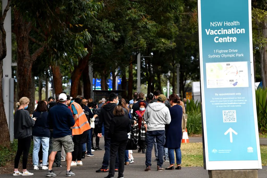 Sydneysiders queue outside a vaccination centre for their dose of vaccine in Sydney, Australia on June 24, 2021. (Saeed Khan/AFP via Getty Images)