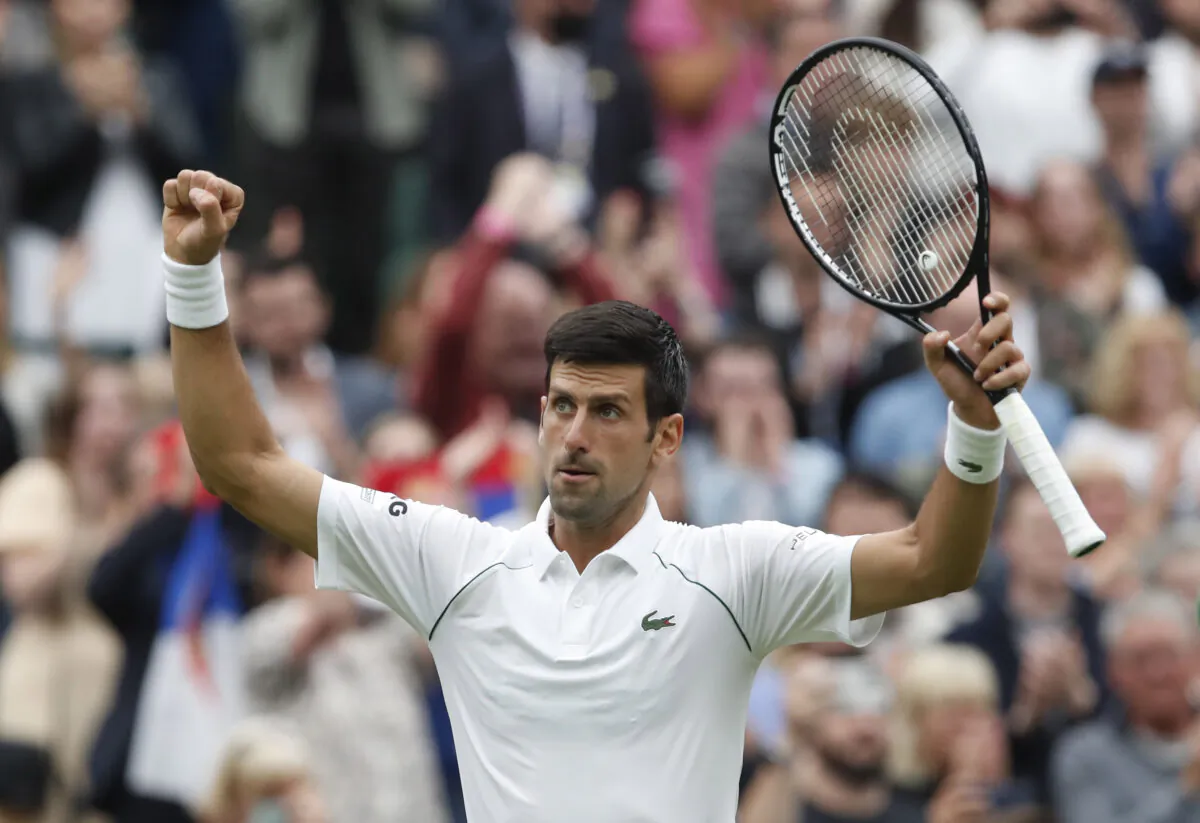 Serbia's Novak Djokovic celebrates winning his first round match against Britain's Jack Draper at All England Lawn Tennis and Croquet Club in London, on June 28, 2021. (Paul Childs/Reuters)