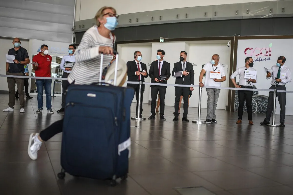 A passenger arrives at Faro airport in Algarve, southern Portugal, on May 17, 2021. (Patririca De Melo Moreira/AFP via Getty Images)