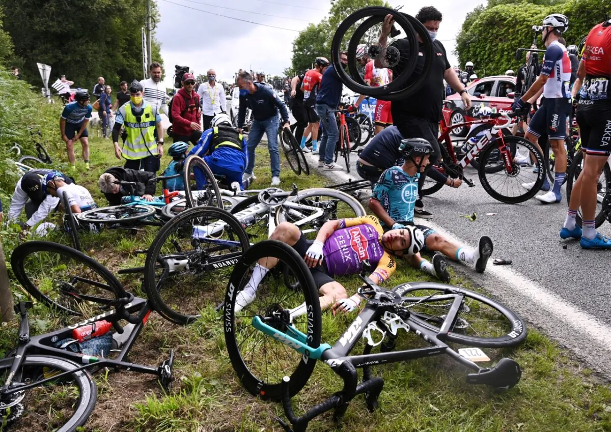 KTM rider Bryan Coquard of France reacts after a crash between Brest and Landerneau in France on June 26, 2021. (Anne-Christine Poujoulat/Reuters)