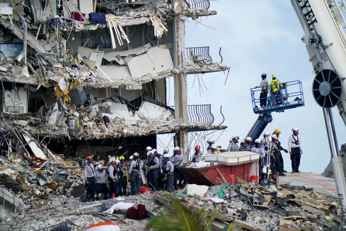 Workers search the rubble at the Champlain Towers South condo in Surfside, Fla., on June 28, 2021. (Lynne Sladky/AP Photo)