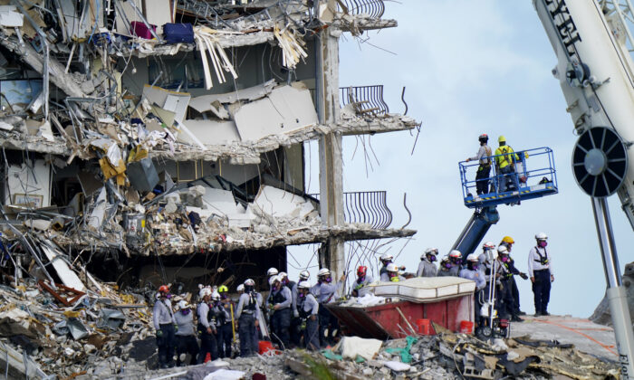 Workers search the rubble at the Champlain Towers South condo in Surfside, Fla., on June 28, 2021. (Lynne Sladky/AP Photo)