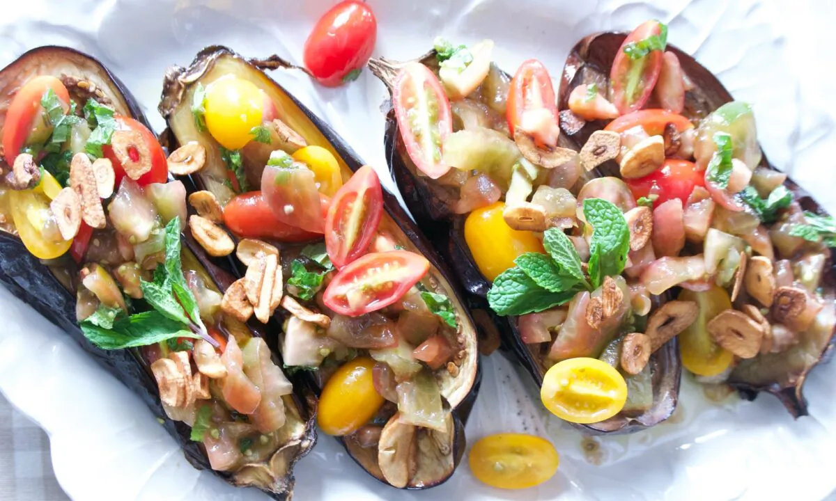 Top simply roasted eggplant with a garlic-infused, vinegar-brightened medley of tomatoes.