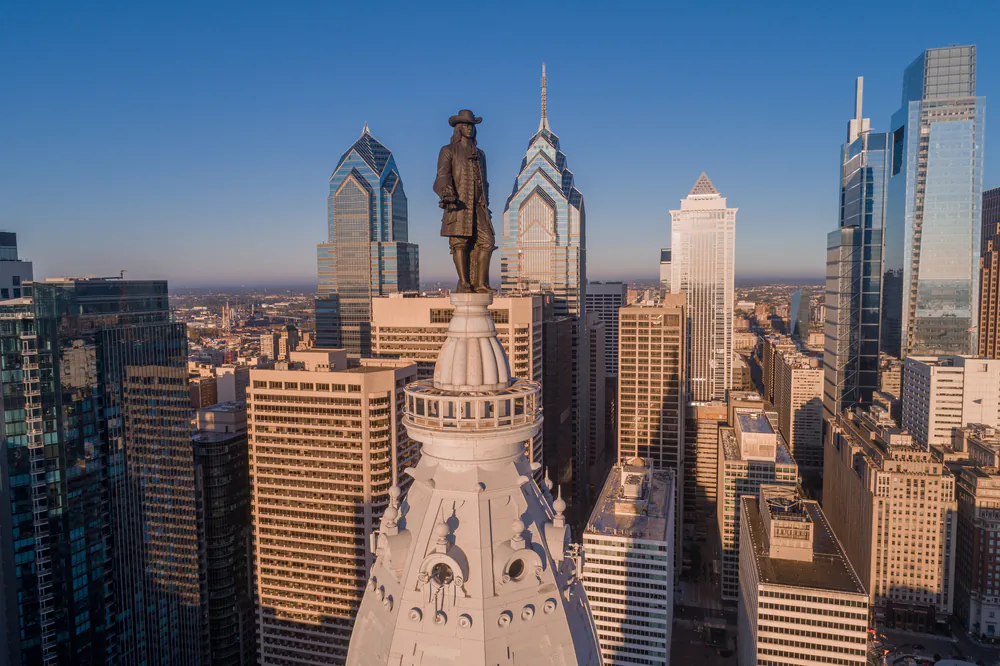 William Penn presides over Philadelphia. The City Hall was the tallest building in Philadelphia for 86 years, due to the respect afforded Penn: One should not build higher than Penn's hat. Times have changed. Although no longer the tallest in the city, the building now has an observation deck below the statue that offers visitors a chance to nearly join Penn and enjoy an expansive view of the city he founded, Philadelphia. (Photosounds/Shutterstock)