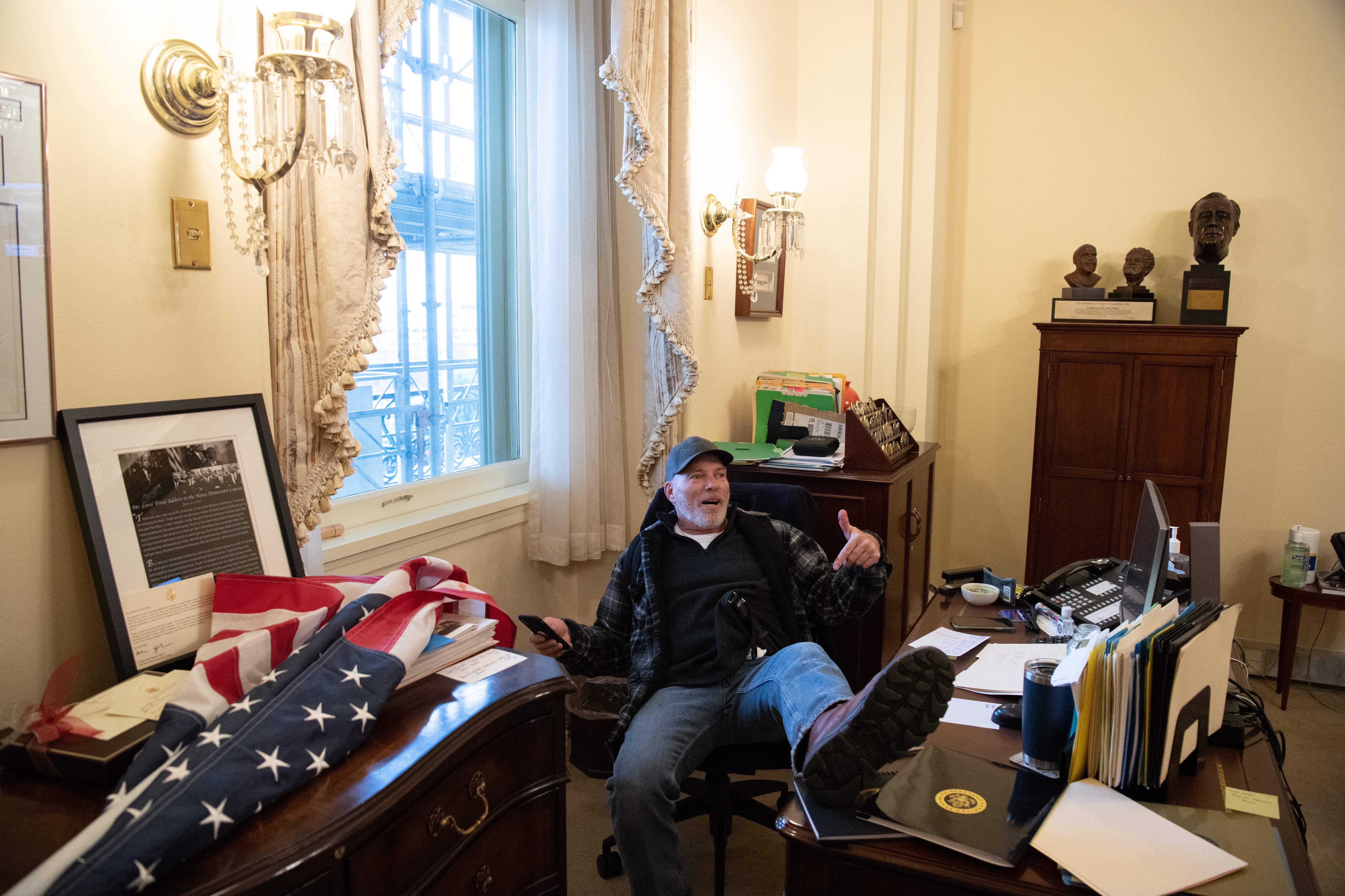 Man Who Put Feet on Desk in Pelosi's Office on Jan. 6 Found Guilty on All Counts - Vimarsana News