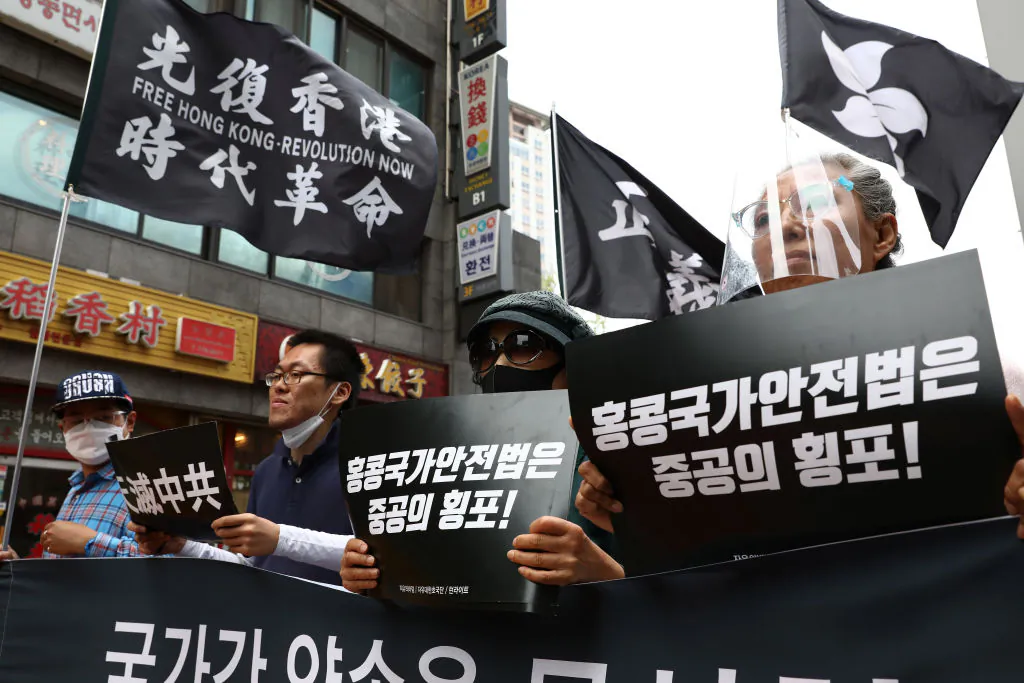 People participate in a rally to support Hong Kong pro-democracy protests in front of Chinese Embassy in Seoul, S. Korea, on July 7, 2020. (Chung Sung-Jun/Getty Images)