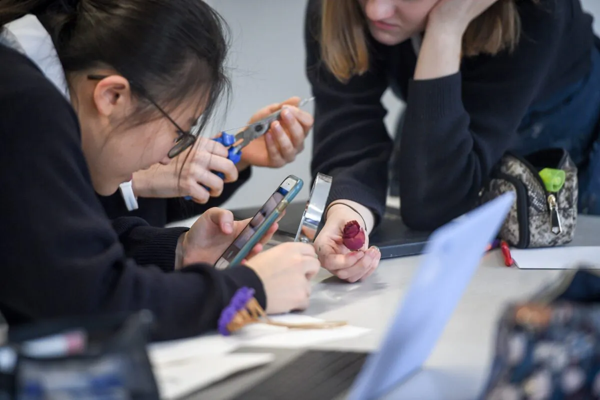 School Children are using mobile phones in an undated photo. (Ben Birchall/PA)