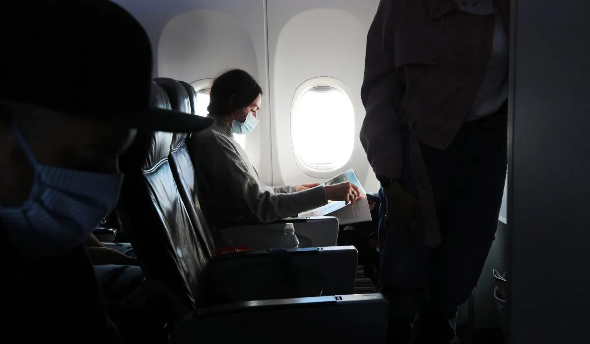 A woman on a plane, in an undated file photo. (Joe Pepler/PinPep/PA)