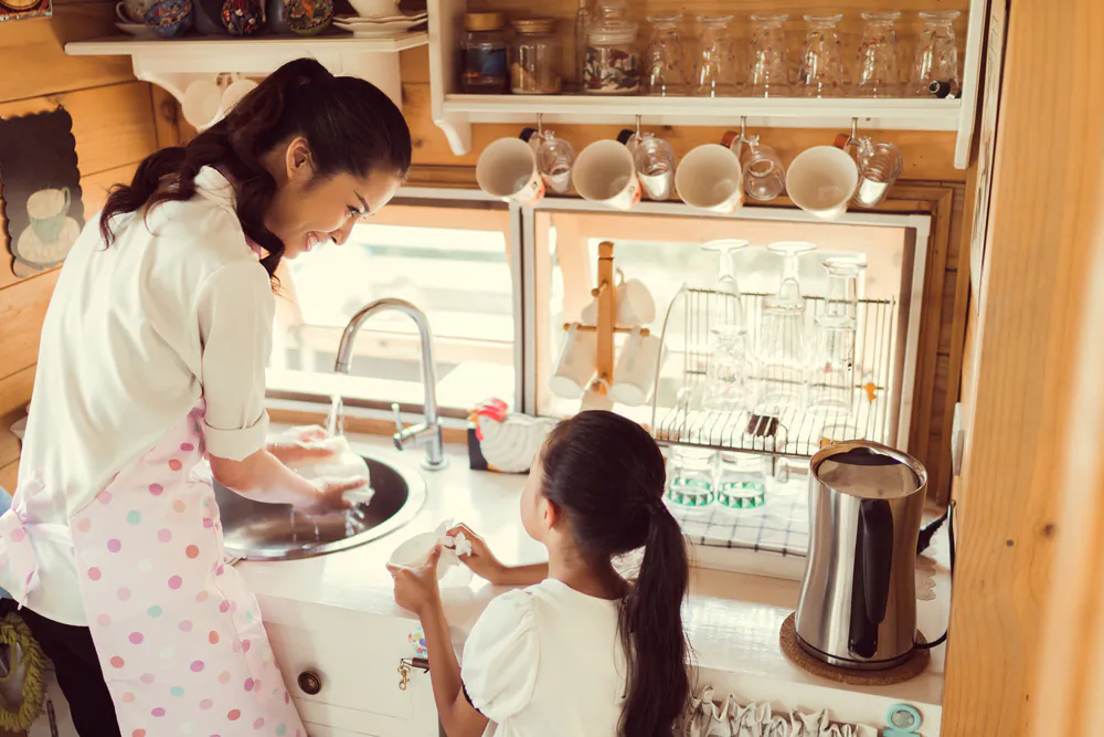 Taking on small cleaning tasks every day is easier than "panic cleaning" when a visitor is due to drop by. (TORWAISTUDIO/Shutterstock)