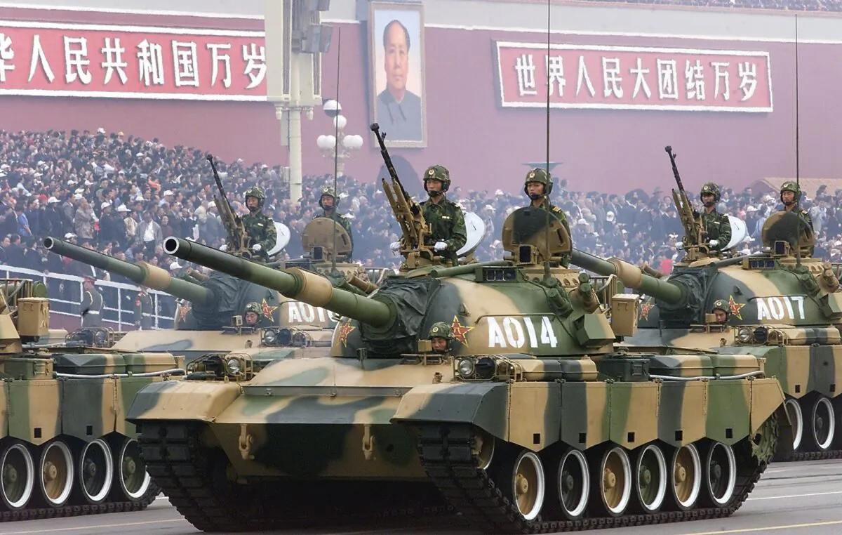 A convoy of People's Liberation Army tanks pass in front of Beijing's Tiananmen Square on Oct. 1, 1999, during a national day parade. (Robyn Beck/AFP via Getty Images)